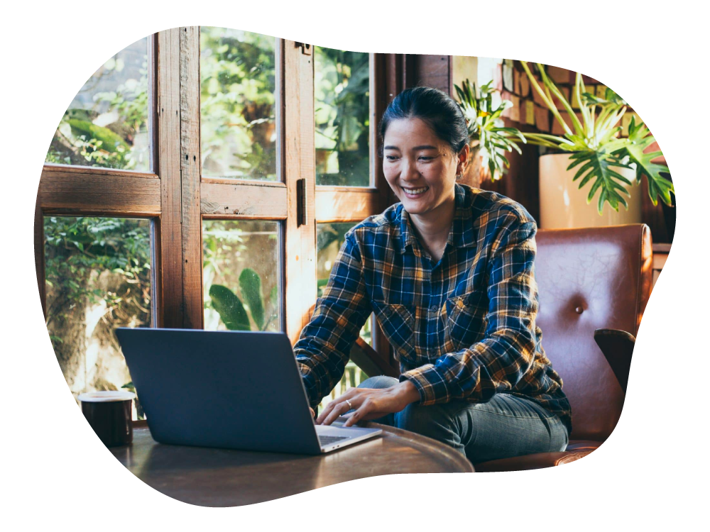 SME business owner monitoring business receivables on laptop in cafe